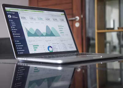 Analyst reviewing financial data on a laptop screen